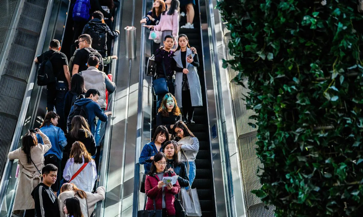 People on an escalator. (Anthony Wallace/AFP/Getty Images)