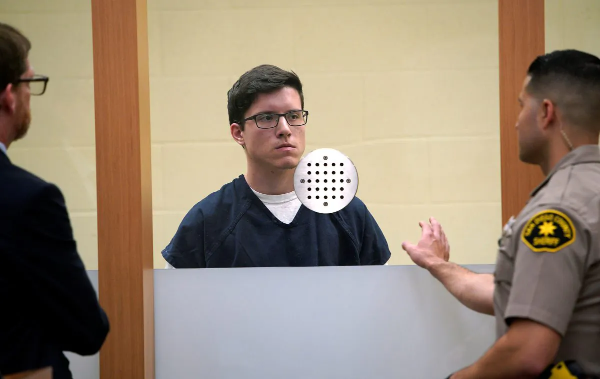 John Earnest, accused in the fatal shooting at the Chabad of Poway synagogue, stands in court near public defender John O'Connell (L) and a San Diego County Bailiff during an arraignment hearing in San Diego, Calif., on April 30, 2019. (Nelvin C. Cepeda/Pool via Reuters)
