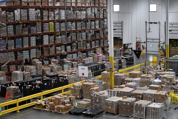 Products, stacked on shelves, are seen at the Amazon fulfillment center