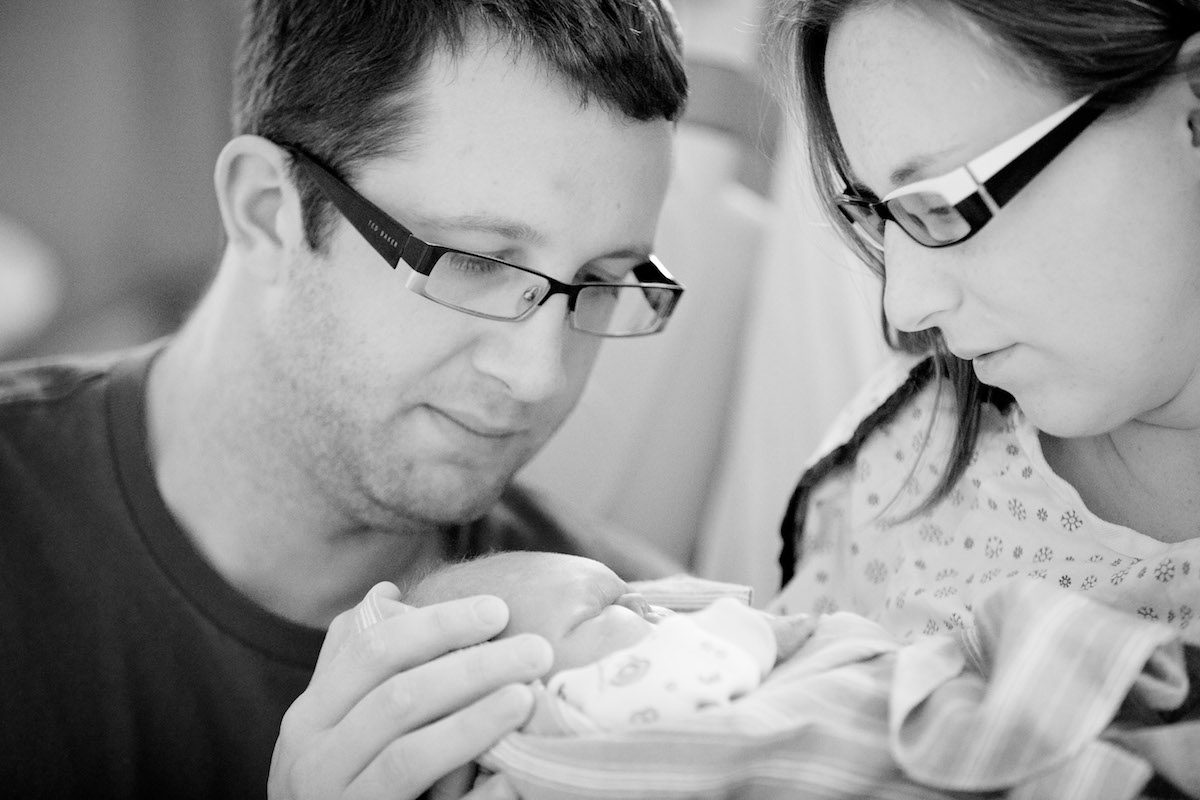 Aaron (L) and Alexis Chute with Zachary after his birth. (C U Photography)