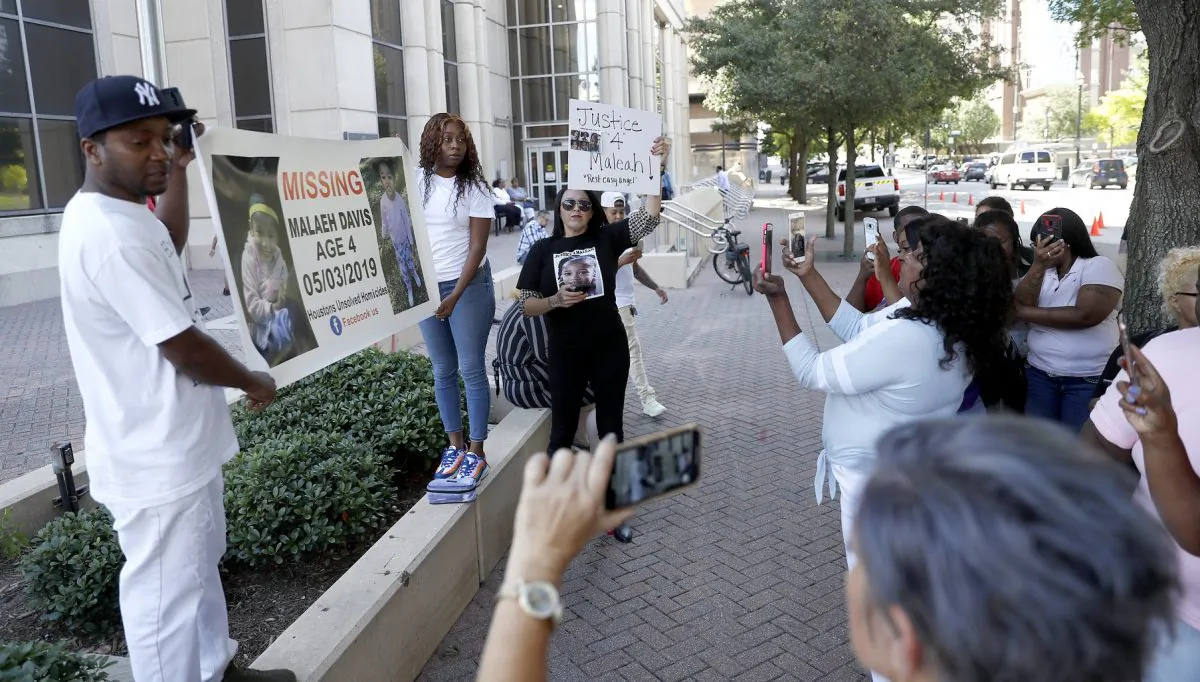 Protesters demanding "Justice for Meleah", stand outside of the courthouse, after the court postponed a court appearance for Derion Vence, who is charged with tampering with evidence in the case of Meleah Davis' disappearance in Houston, on May 13, 2019. (Karen Warren/Houston Chronicle via AP)