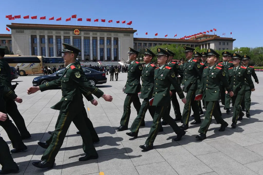 Paramilitary police officers march in Tiananmen Square after attending a ceremony marking the centennial of the May Fourth Movement, a landmark student protest against colonialism and imperialism, in Beijing on April 30, 2019. (GREG BAKER/AFP/Getty Images)
