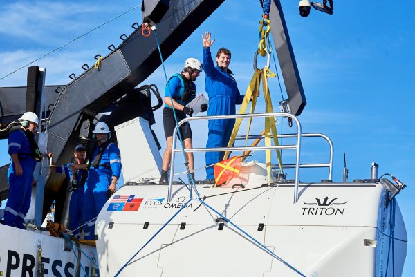 mission specialist stands on submarine