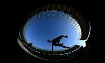 College Hurdler Goes the ‘Full Superman’ to Clinch Title