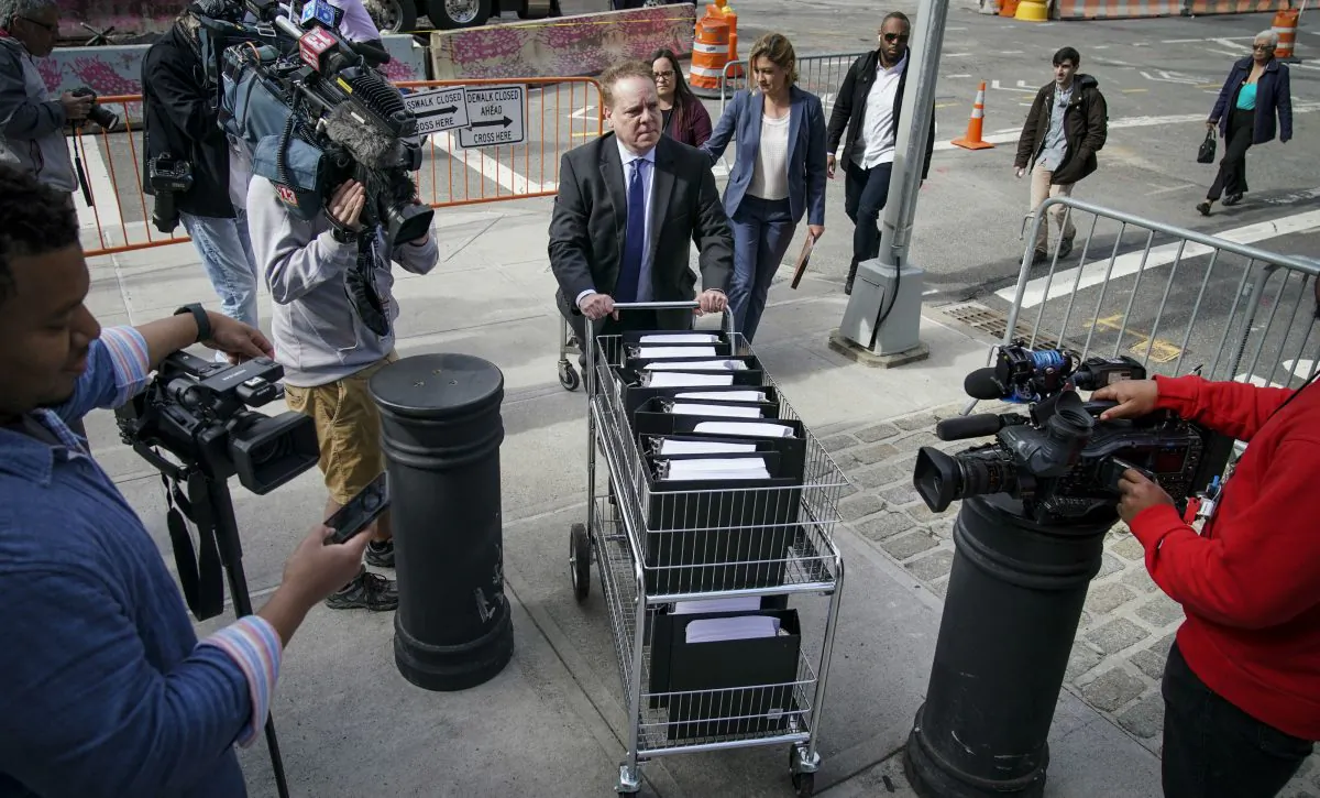 John Marzulli, public information officer for the U.S. Attorneys Office of the Eastern District of New York, pushes a cart full of court documents on the U.S. v. Keith Raniere case at the U.S. District Court for the Eastern District of New York in the Brooklyn borough of New York City on May 7, 2019. (Drew Angerer/Getty Images)