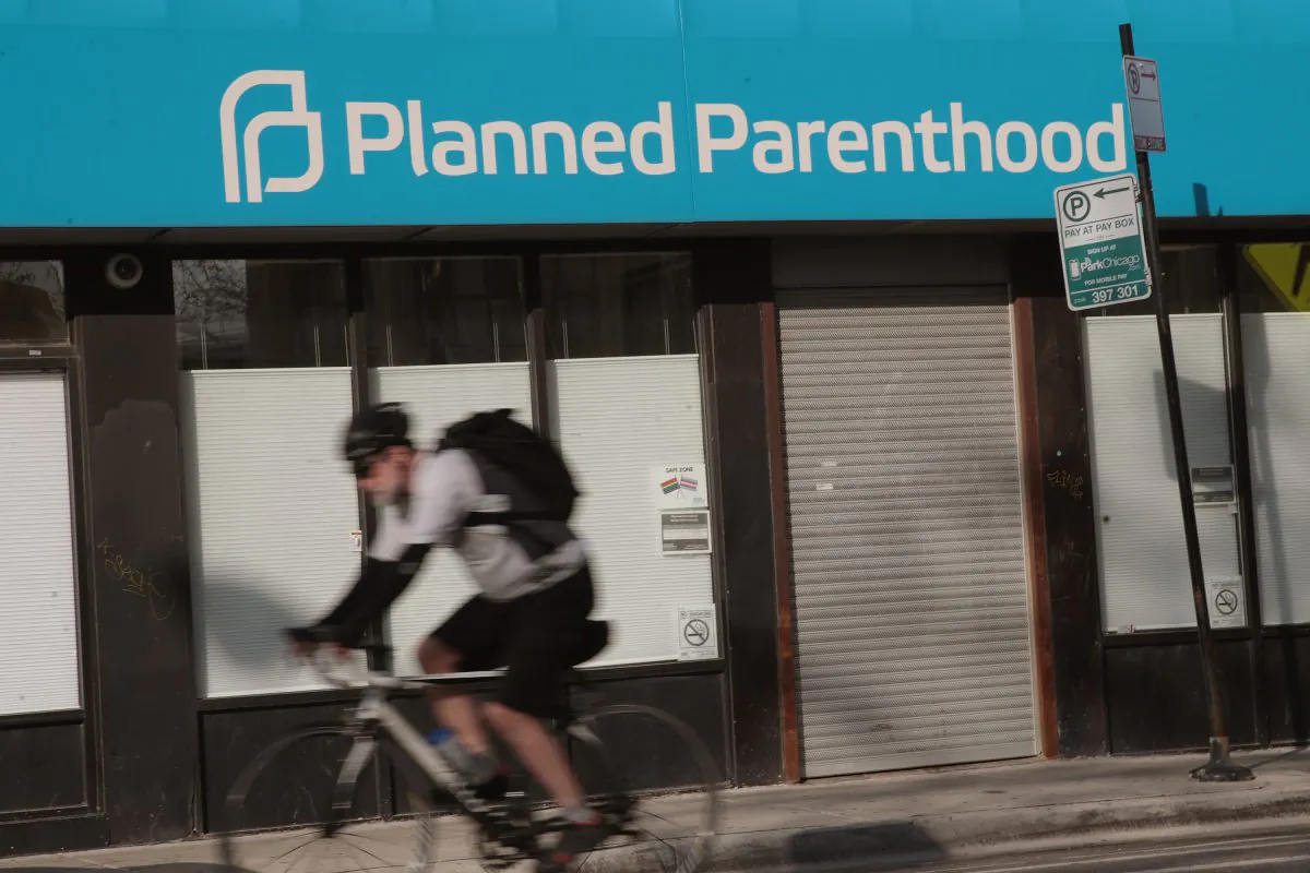 A cyclist rides past a Planned Parenthood clinic in Chicago on May 18, 2018. (Scott Olson/Getty Images)