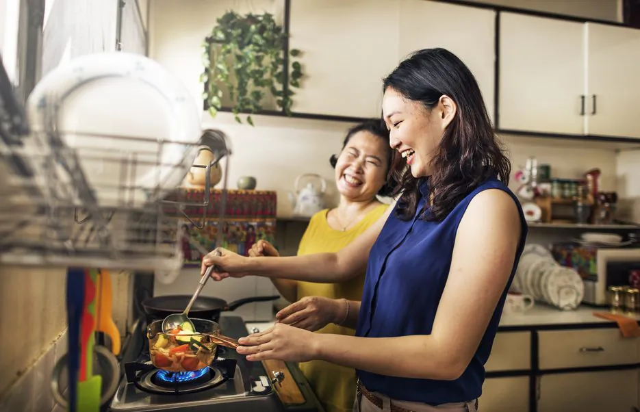 Some of the loveliest moments can come from two people working side by side in the kitchen. (Shutterstock)﻿