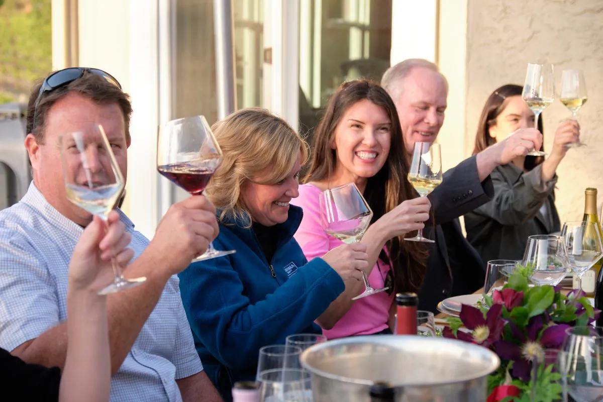 In Sonoma, the author (center) and friends raise their glasses—to wine! (Courtesy of Amanda Burrill)