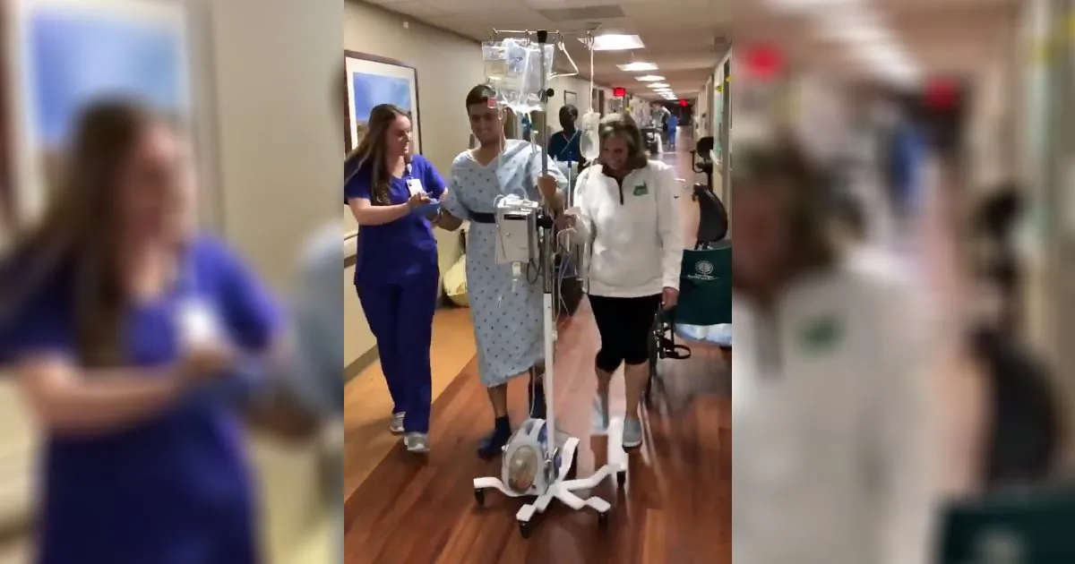 Survivor Drew Pescaro walks for the first time since the University of North Carolina Charlotte shooting at a hospital in North Carolina on May 13, 2019. (Drew Pescaro/Twitter)
