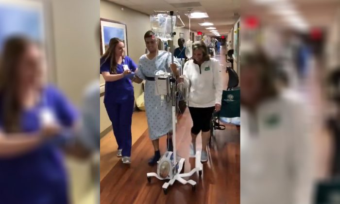 Survivor Drew Pescaro walks for the first time since the University of North Carolina Charlotte shooting at a hospital in North Carolina on May 13, 2019. (Drew Pescaro/Twitter)