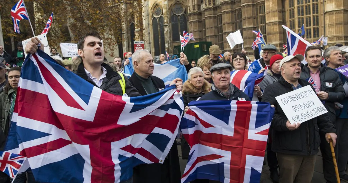 Pro-Brexit demonstrators hold Union Jack flags as they protest outside the Houses of Parliament in London on Nov. 23, 2016. (Jack Taylor/Getty Images)