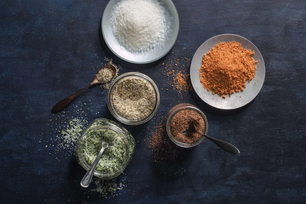 Flavored salts, spiked with anything from fresh herbs to liquid smoke, are easy—and cheaper—to make at home. (Courtesy of America's Test Kitchen)