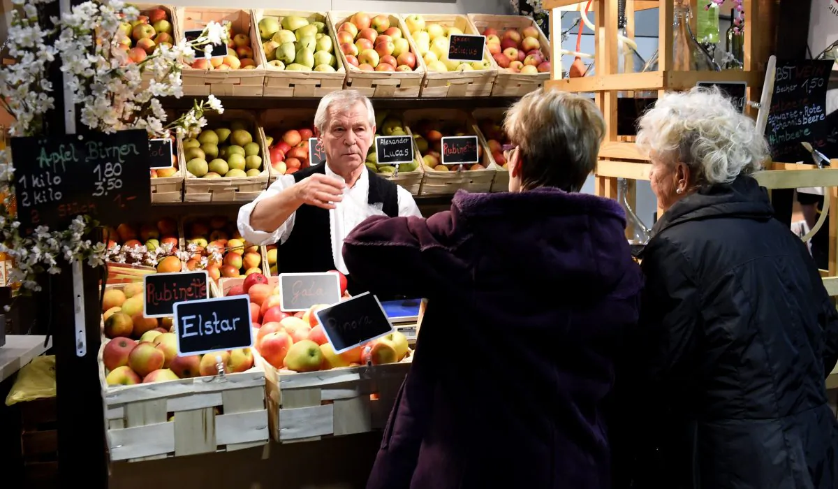 A vendor sells apples in Berlin, Germany, in a file photo. The European Court of Justice has ruled that all employers must set up a system to record hours worked by staff. (Tobias Schwarz/AFP/Getty Images)
