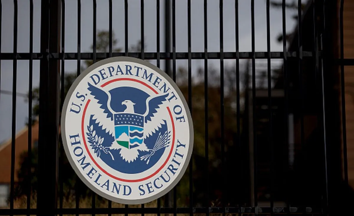 The U.S. Department of Homeland Security (DHS) seal hangs on a fence at the agency's headquarters in Washington on Dec. 11, 2014. (Andrew Harrer/Bloomberg via Getty Images)