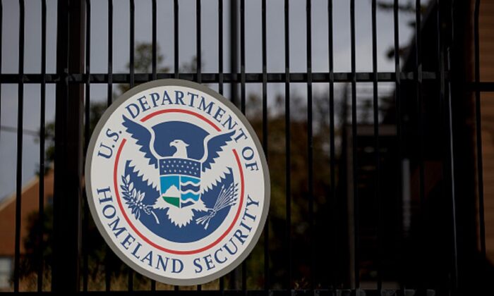 The U.S. Department of Homeland Security (DHS) seal hangs on a fence at the agency's headquarters in Washington on Dec. 11, 2014. (Andrew Harrer/Bloomberg via Getty Images)