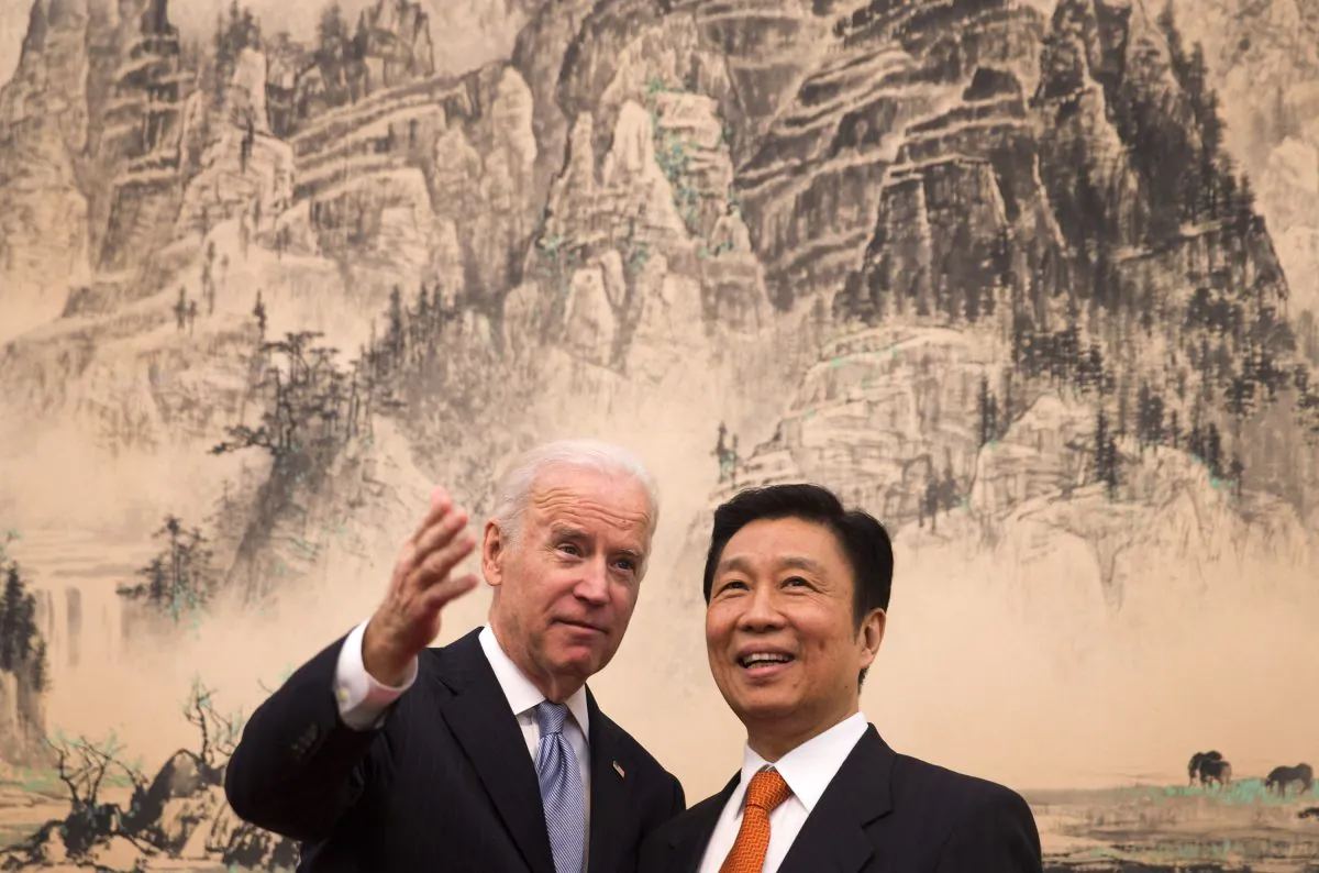 Then-Vice President Joe Biden (L) chats with Chinese Vice Chair Li Yuanchao in Beijing on Dec. 5, 2013. (Andy Wong-Pool/Getty Images)