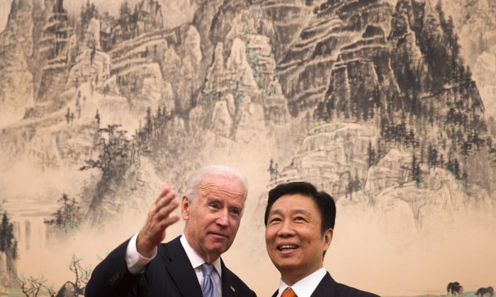 Then-Vice President Joe Biden (L) chats with Chinese Vice Chair Li Yuanchao in Beijing on Dec. 5, 2013. (Andy Wong-Pool/Getty Images)
