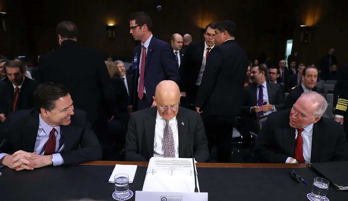 (L-R) FBI Director James Comey, Director of National Intelligence James Clapper and Central Intelligence Agency Director John Brennan wait to testify before the Senate Intelligence Committee on Jan. 10, 2017. (Joe Raedle/Getty Images)