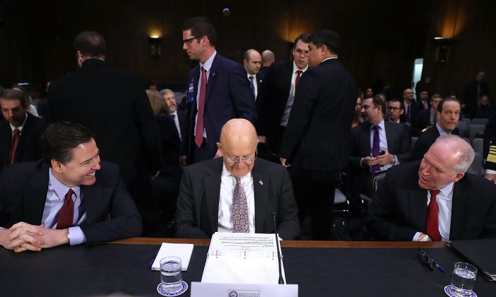 (L-R) FBI Director James Comey, Director of National Intelligence James Clapper and Central Intelligence Agency Director John Brennan wait to testify before the Senate Intelligence Committee on Jan. 10, 2017. (Joe Raedle/Getty Images)