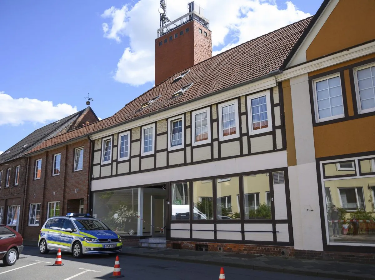 A police car in front of a building where the bodies of two women were found in Wittingen, Germany, on May 13, 2019. (Christophe Gateau/DPA via AP)