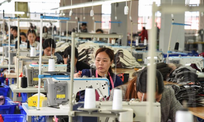 Employees in a textile factory in Rongjiang, China. (STR/AFP/Getty Images)