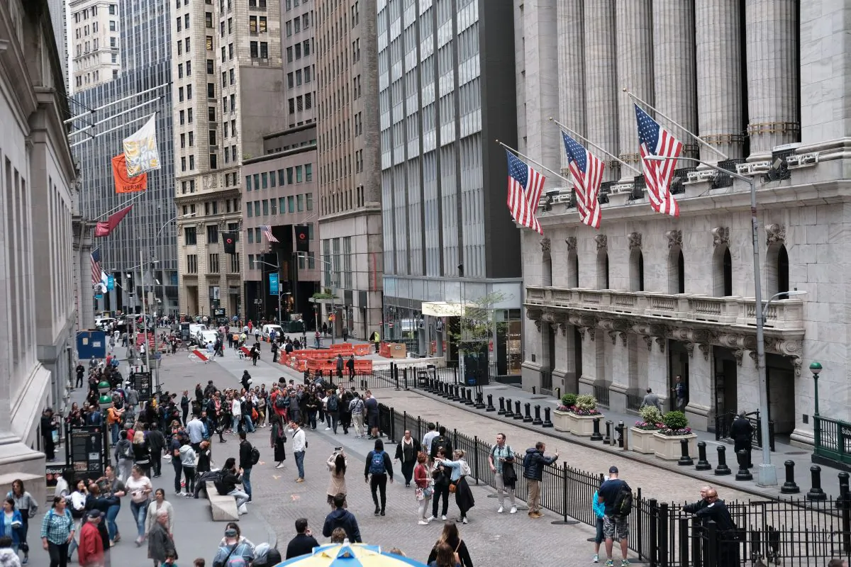 People walk outside of the New York stock Exchange (NYSE) in New York City on May 6, 2019. (Spencer Platt/Getty Images)