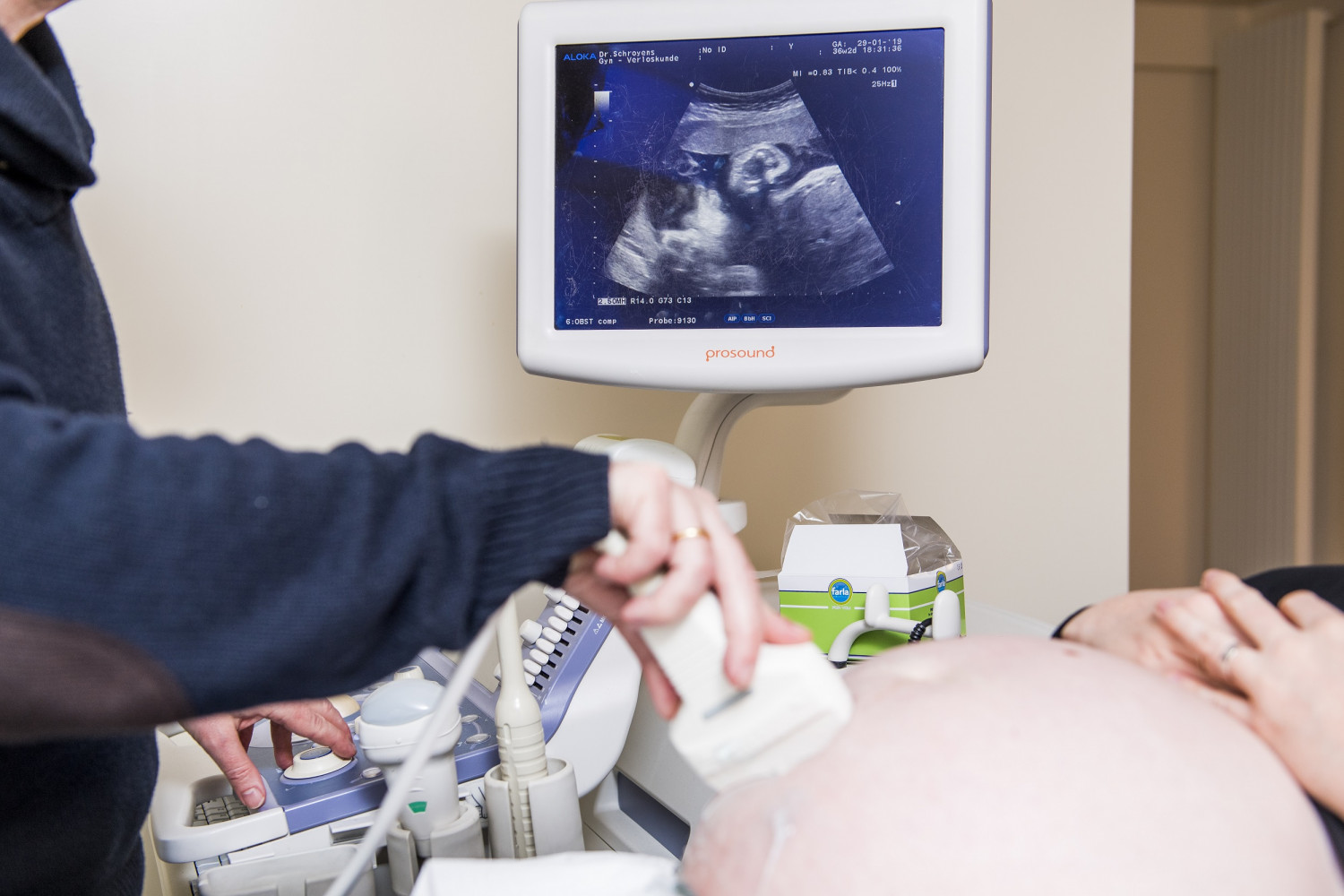 a doctor performs an ultrasound