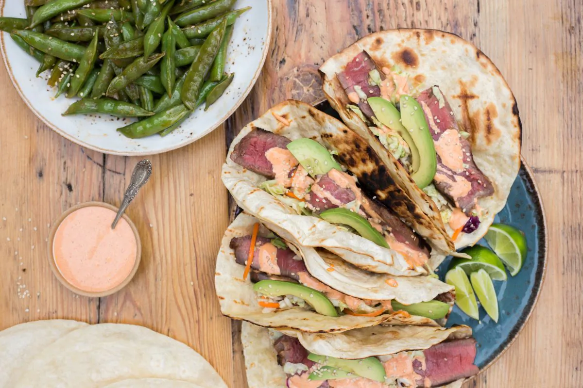 Salty, spicy, creamy, and crunchy, these tacos are the perfect excuse to dust your grill off after months of wintry neglect. (Caroline Chambers)