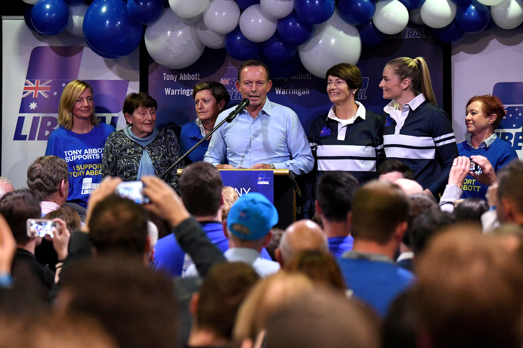 Australia's former Prime Minister and Warringah Liberal candidate Tony Abbott is joined on stage by family members after conceding defeat at Manly Leagues Club in Brookvale, Sydney