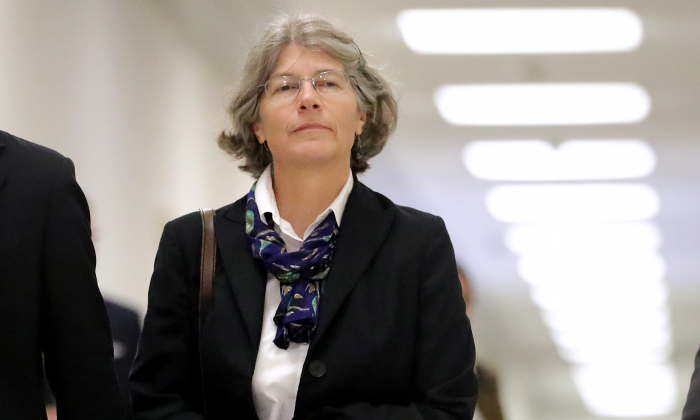 Fusion GPS contractor Nellie Ohr arrives for a closed-door interview with investigators from the House Judiciary and Oversight committees in the Rayburn House Office Building on Capitol Hill on Oct. 19, 2018. (Chip Somodevilla/Getty Images)