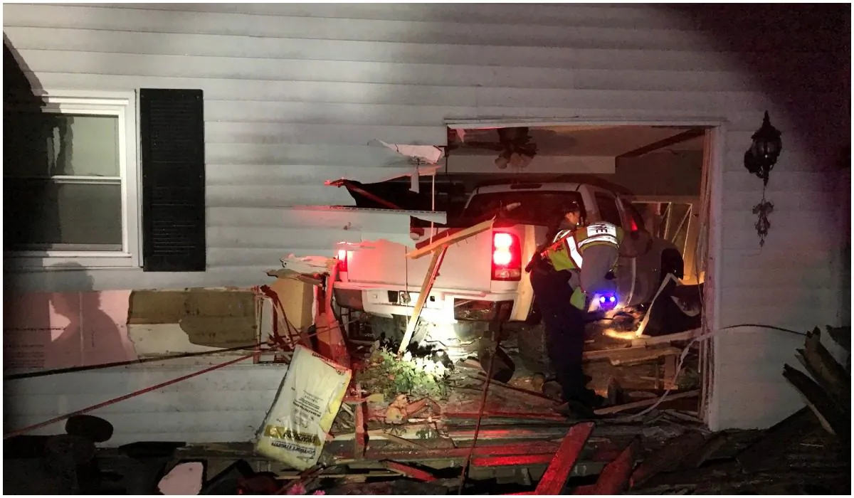 A GMC Pick up truck embedded in a house in Spring Grove, Lake County, Illinois. (Lake County Sheriff's Office)