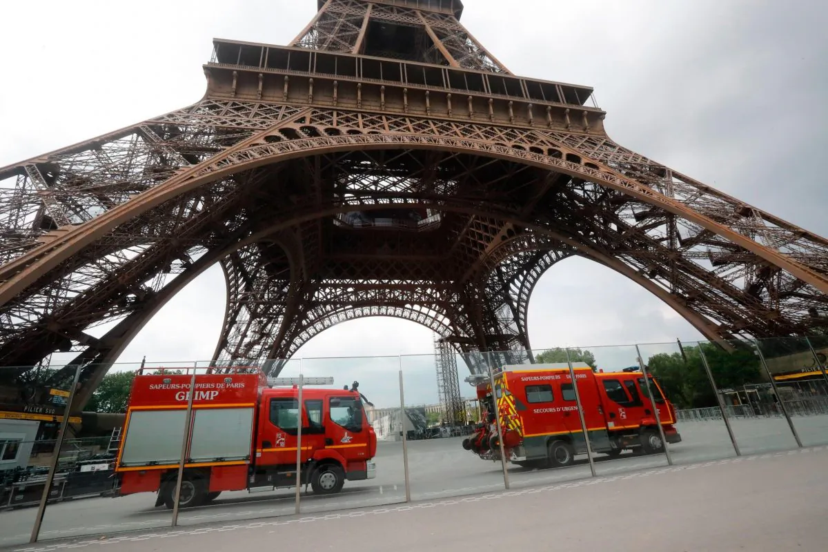 Firefighters at the scene said they were in contact with the man who climbed the Eiffel Tower, Paris, France, on May 19, 2019. (Michel Euler/AP Photo)