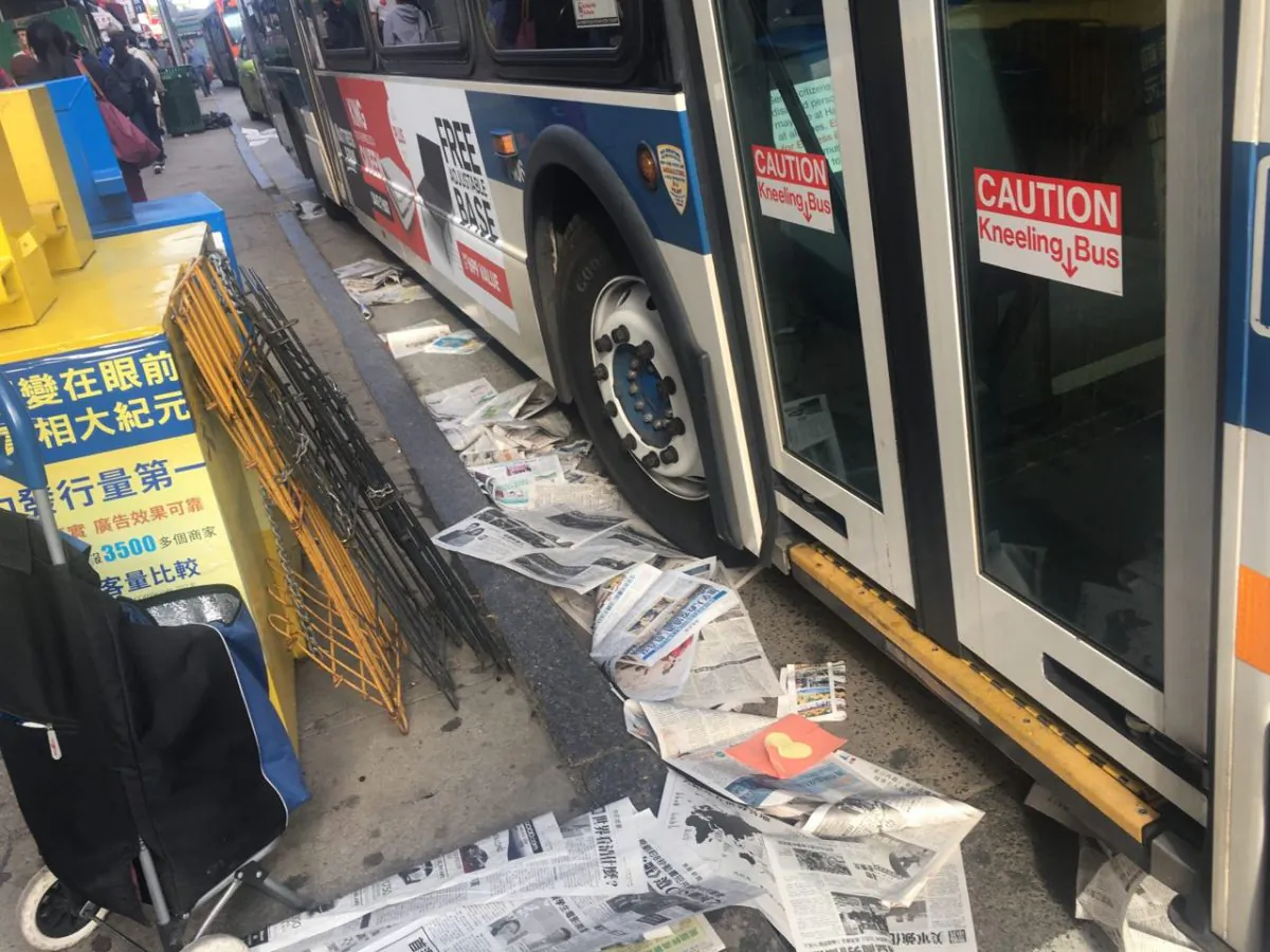 Newspaper copies of the Chinese-language edition of The Epoch Times, scattered on the ground after an apparent attempt to sabotage the publication's newspaper boxes, on May 11, 2019. (Courtesy of Sun Tong)