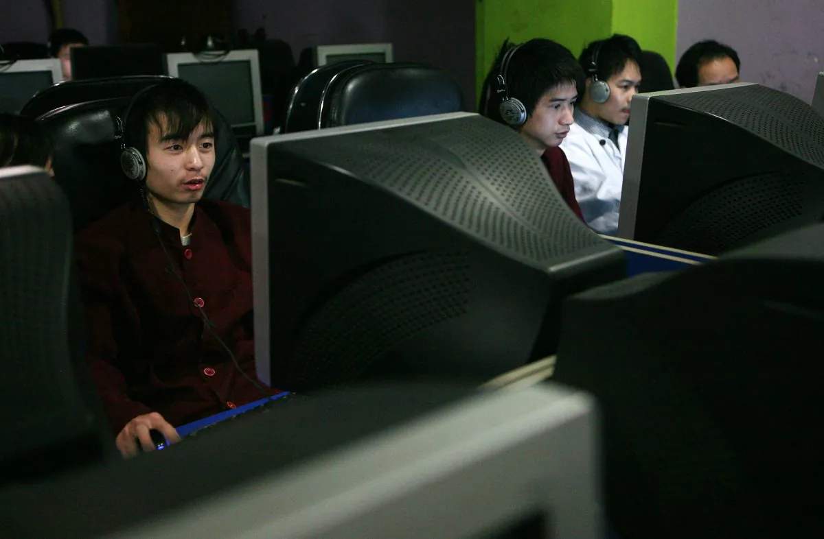 Chinese youths surf the internet in a net cafe on January 21, 2008 in Chongqing Municipality, China. (China Photos/Getty Images)