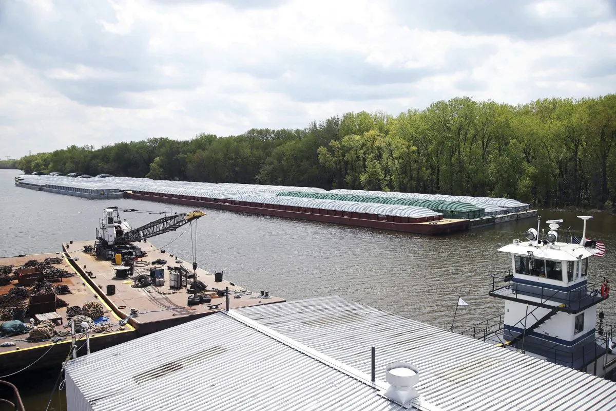 Barges already loaded with soy beans, potash or scrap steel await movement on the Mississippi River in St. Paul, Minn., (Jim Mone/AP)