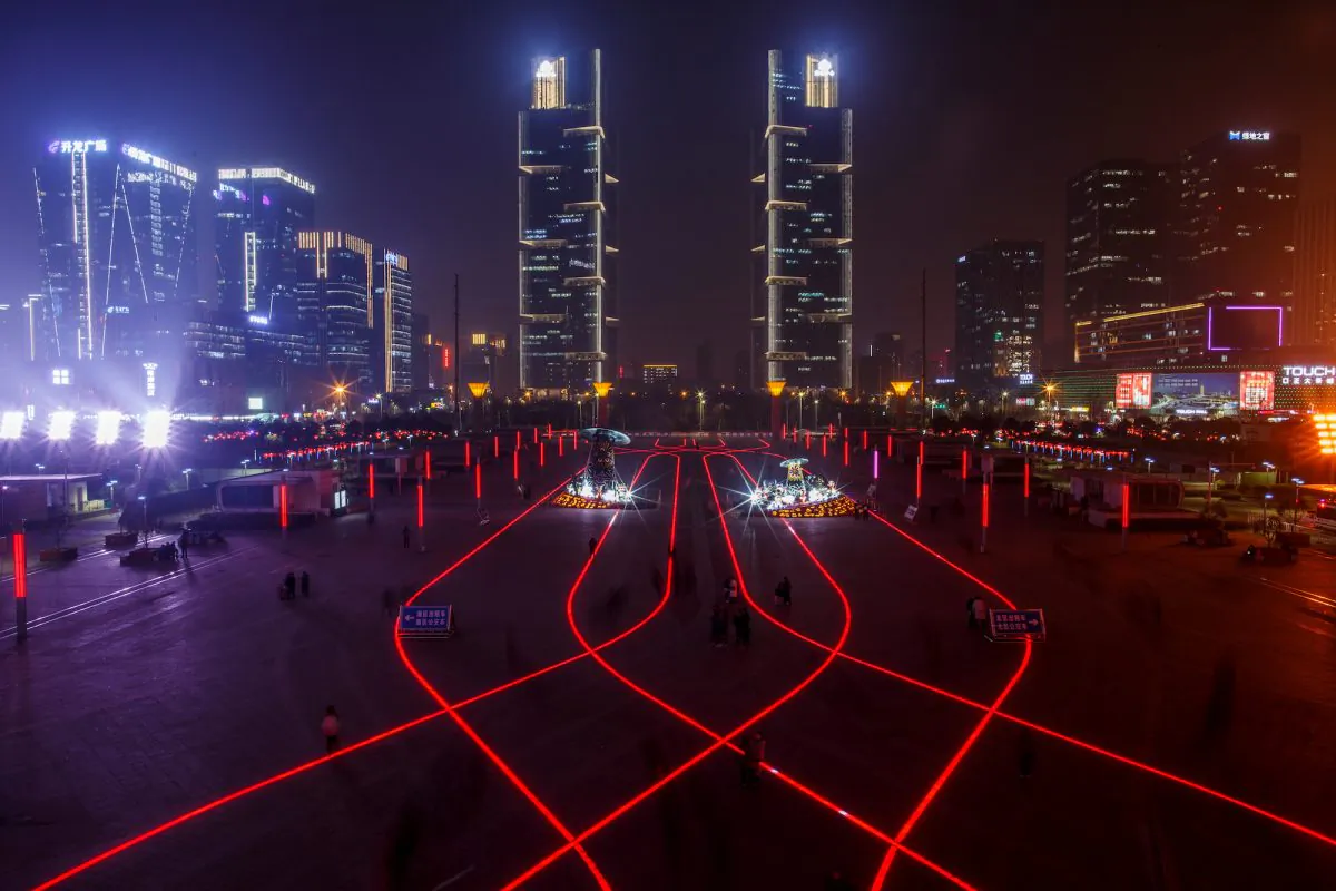 LED lights in the pavement illuminate the square in front of the highspeed railway station in the new business district of Zhengzhou, Henan Province, China on Feb. 22, 2019. (Thomas Peter/Reuters)