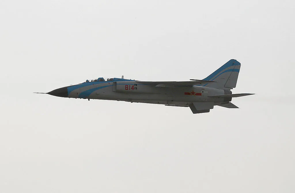 A fighter jet flies by after another jet crashed during an air show in Fucheng, in China's northern Shaanxi Province, on Oct. 14, 2011. A fighter jet plunged to the ground and exploded, leaving one pilot missing, organizers and state media said. (STR/AFP/Getty Images)