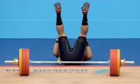 Weightlifter Snaps Leg During Squat Lift During Competition