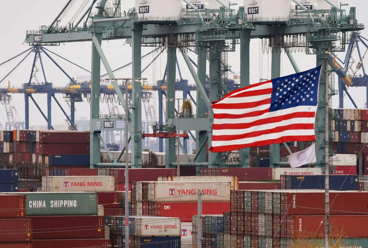 International shipping containers beside a U.S. flag at the Port of Los Angeles in Long Beach, Calif., on May 14, 2019. (Mark Ralston/AFP/Getty Images)