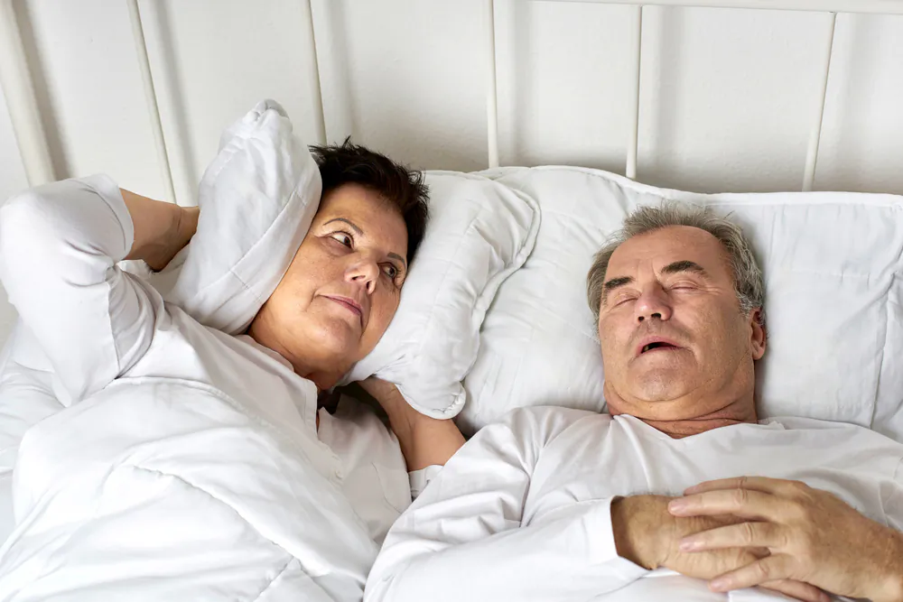 Our respective positions on the question of snoring are, as they say about the War on Terror—asymmetric. (Jenny Storm/Shutterstock)
