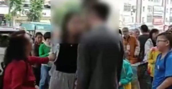 Woman slap crowd