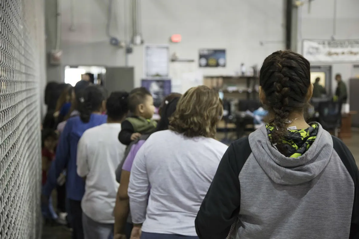 In this handout photo provided by U.S. Customs and Border Protection, U.S. Border Patrol agents conduct intake of illegal border crossers at the Central Processing Center on June 17, 2018 in McAllen, Texas. (Photo by U.S. Customs and Border Protection via Getty Images)