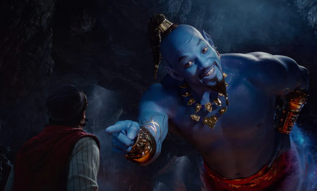 Mena Massoud as Aladdin (L) and Will Smith as Genie in Disney's live-action adaptation of the 1992 animated classic "Aladdin." (Disney via AP)