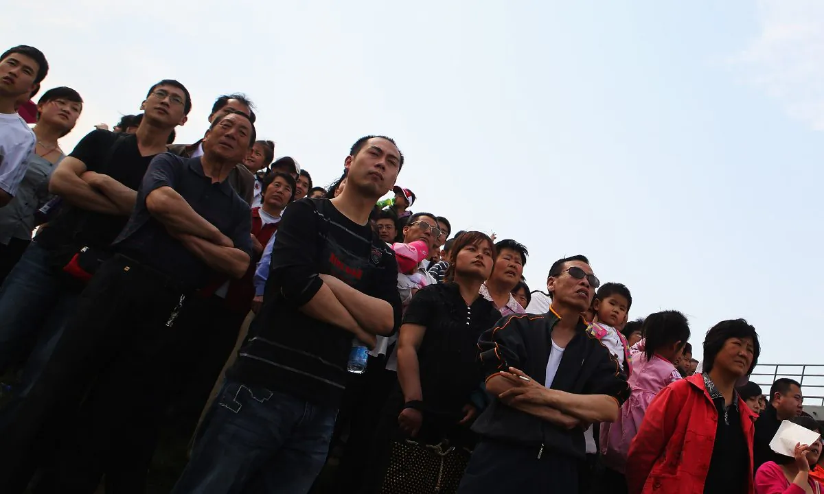 Chinese onlookers. (Feng Li/Getty Images)