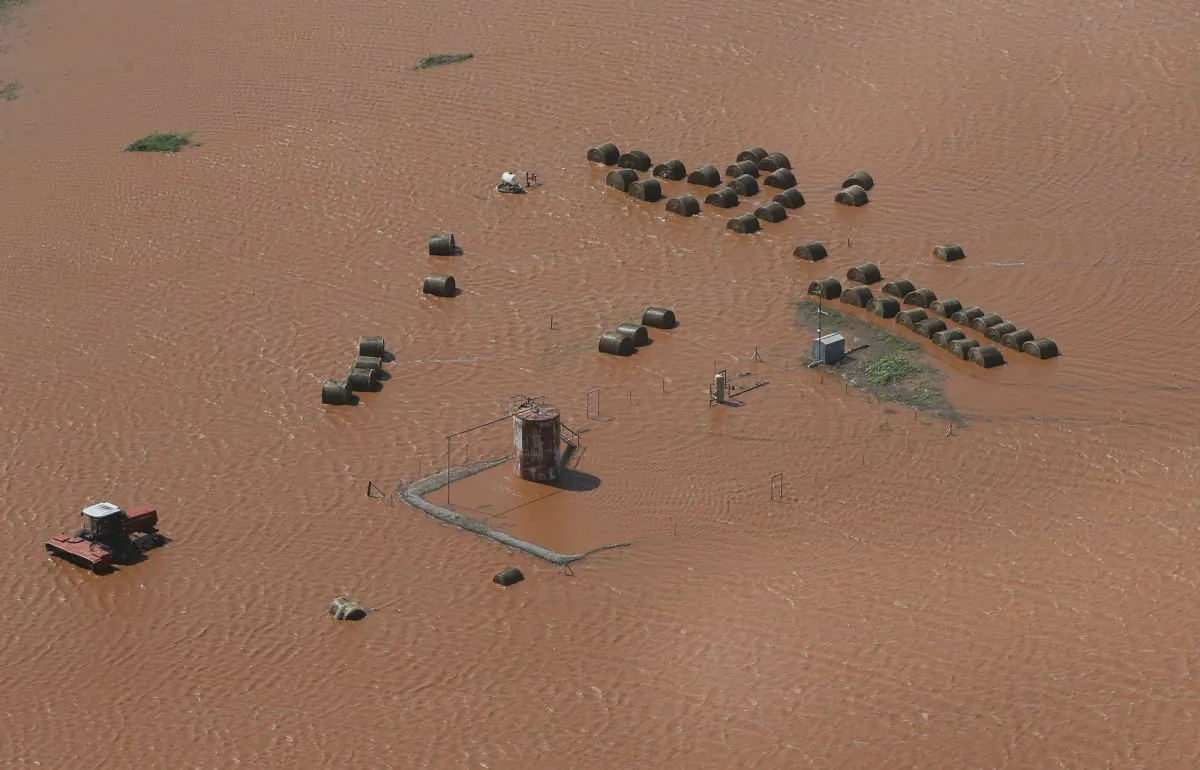 Hay bales and equipment are pictured in a flooded field, in Kingfisher, Okla., on May 21, 2019. (Sue Ogrocki/AP Photo)