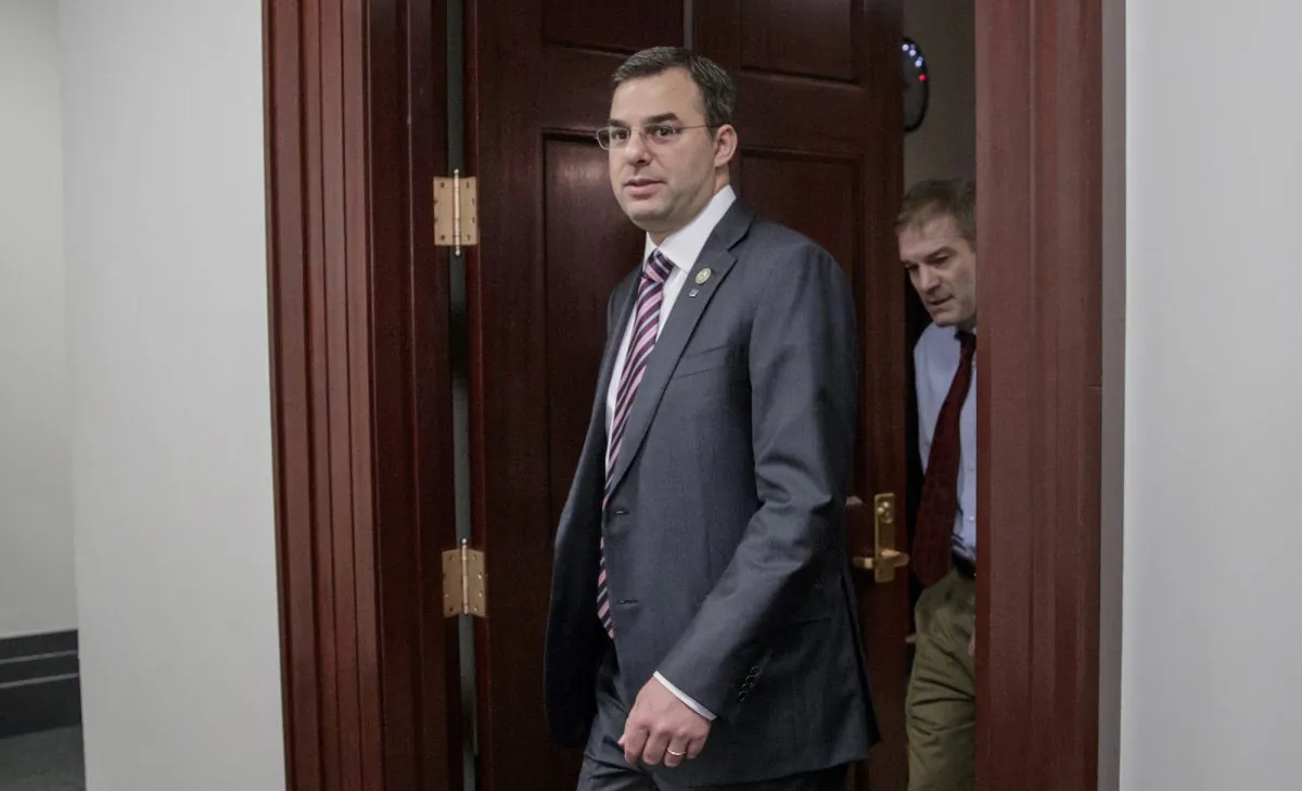 Rep. Justin Amash, R-Mich., followed by Rep. Jim Jordan, R-Ohio, leaving a closed-door strategy session on March 28, 2017. (J. Scott Applewhite/AP Photo)