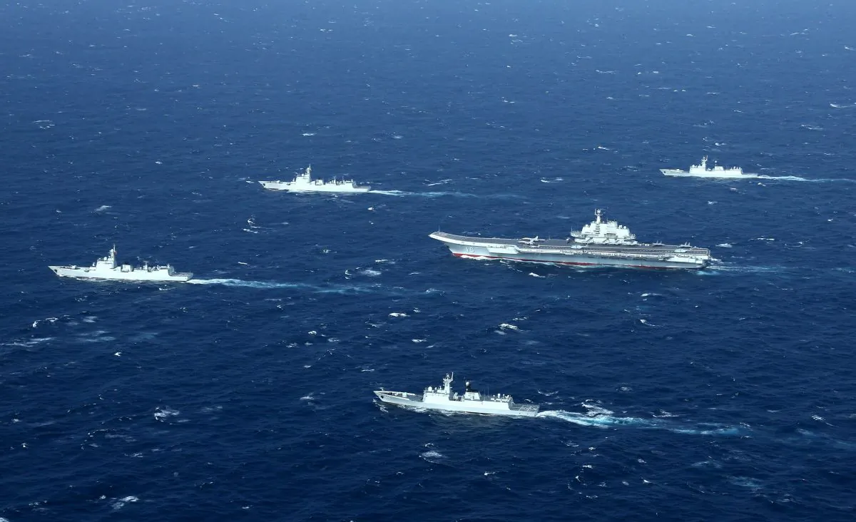 This aerial photo taken on Jan. 2, 2017, shows a Chinese navy formation, including the aircraft carrier Liaoning (C), during military drills in the South China Sea. (STR/AFP/Getty Images)