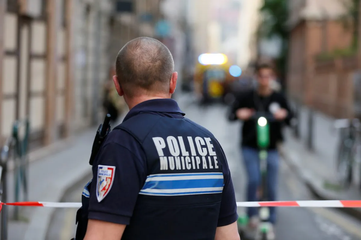 A policeman looks on near the site of a suspected bomb attack in central Lyon, France, on May 24, 2019. (Emmanuel Foudrot/Reuters)