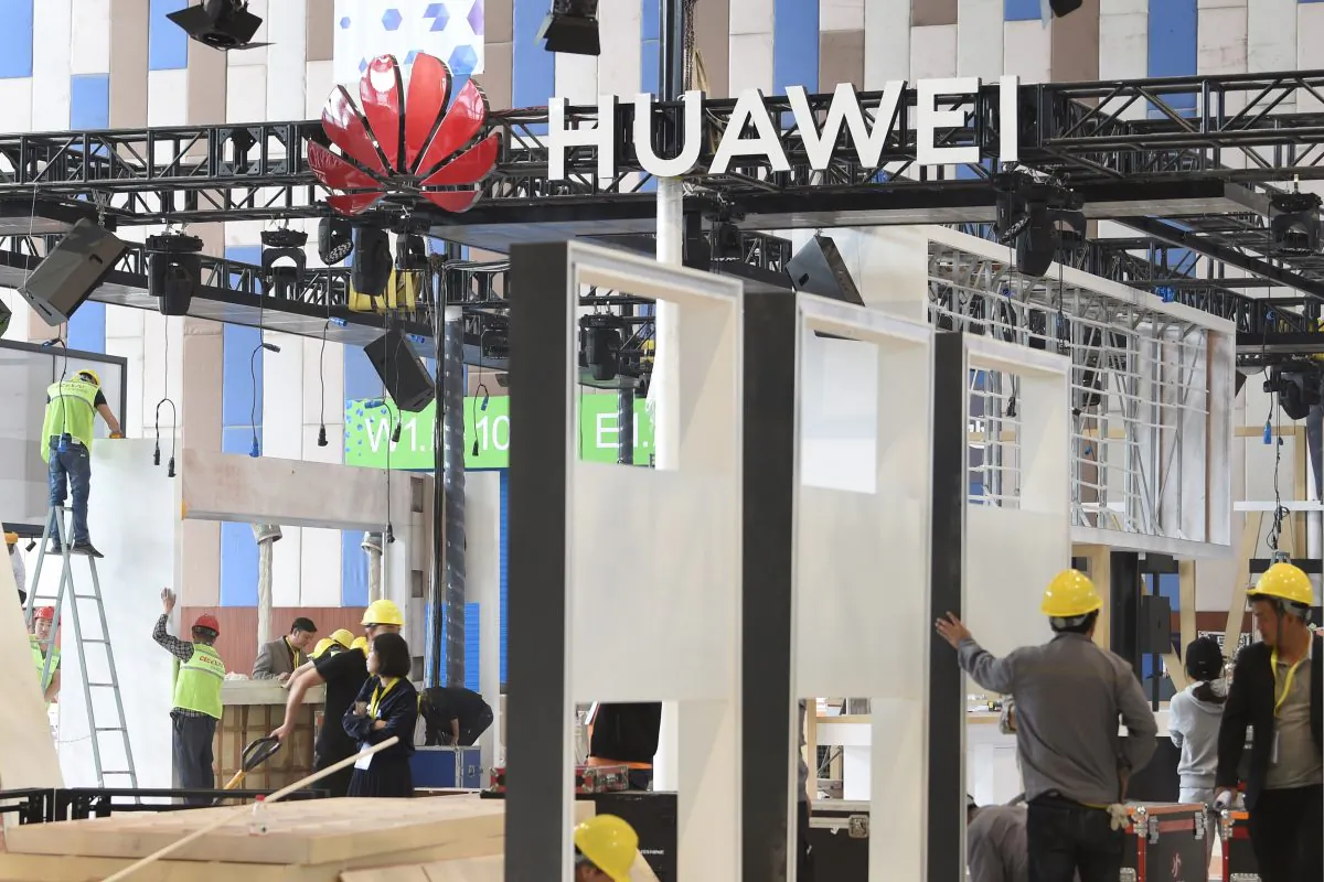 Workers are seen near the booth of Huawei under construction at the venue of China International Big Data Industry Expo in Guiyang, Guizhou Province, China on May 22, 2019. (Reuters)