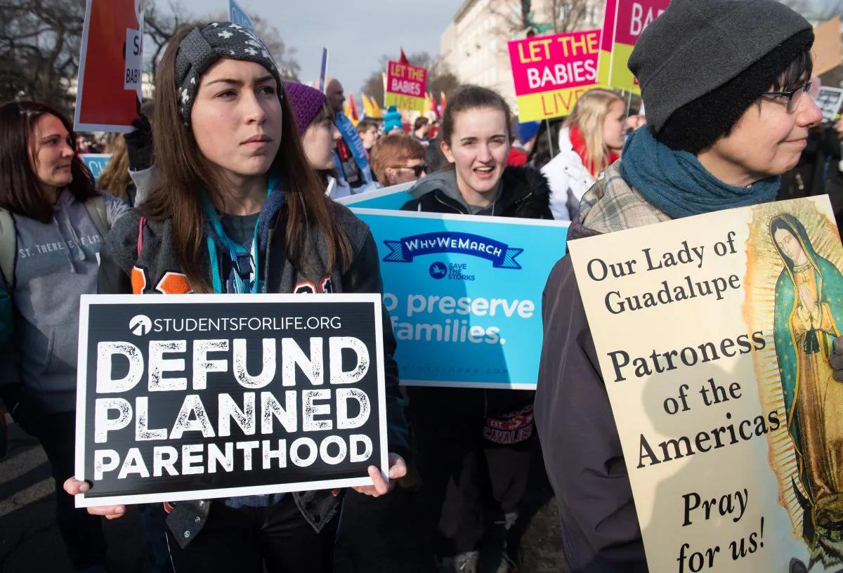 Anti-abortion activists participate in the "March for Life," an annual event to mark the anniversary of the 1973 Supreme Court case Roe v. Wade, which legalized abortion in the US, outside the US Supreme Court in Washington, DC, January 18, 2019. (Saul Loeb/AFP/Getty Images)